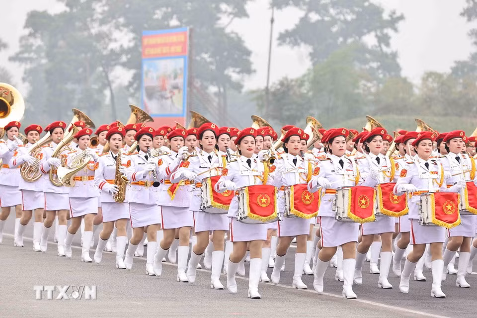 The women's military band marches during the parade.