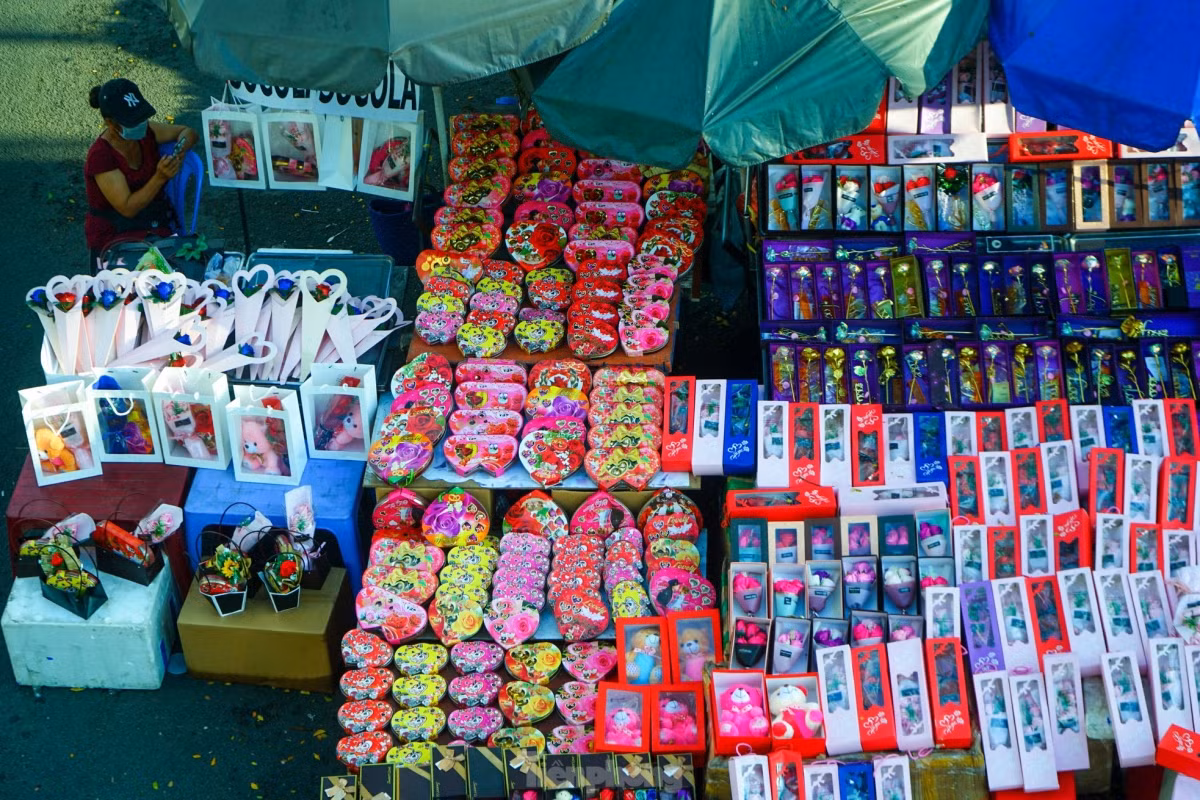 Gift boxes of chocolate candies and cakes are sold on pavements throughout Ho Chi Minh City, traders list prices at VND230,000 to VND700,000 a box.