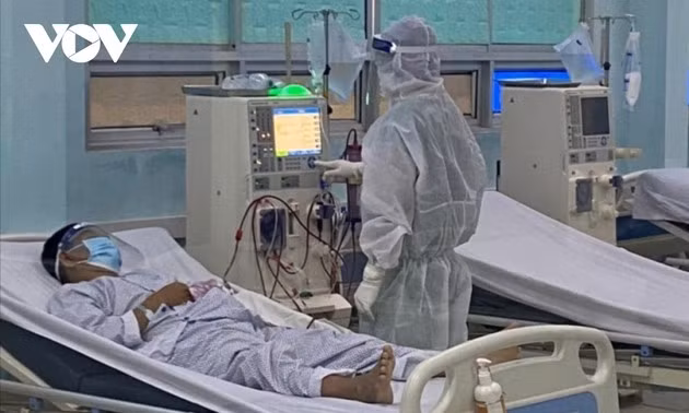 A critical COVID-19 patient receives treatment&nbsp; at an ICU.