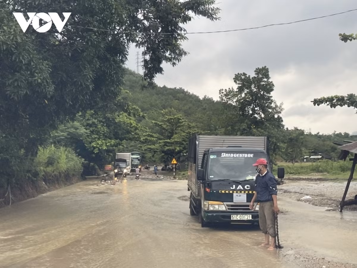 Heavy rain causes water to spill over the trans-national Ho Chi Minh Highway.