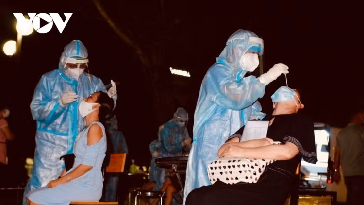 Taking nasal swabs for COVID-19 testing in Vietnam.