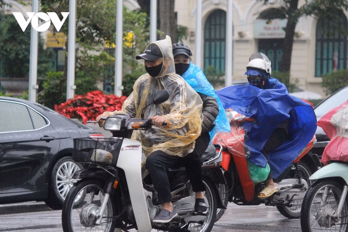 A number of residents choose to wear raincoats as they battle against the cold conditions.