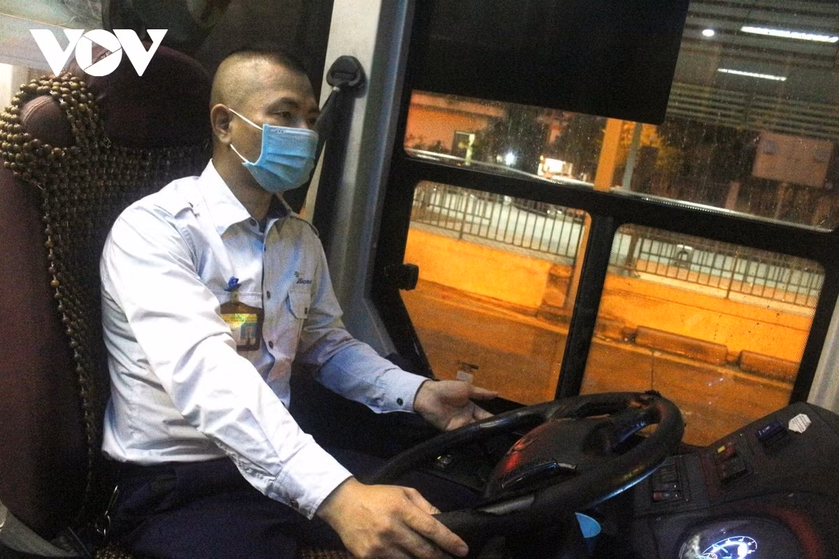 The driver, staff, and passengers show their joy at resuming their daily routine.