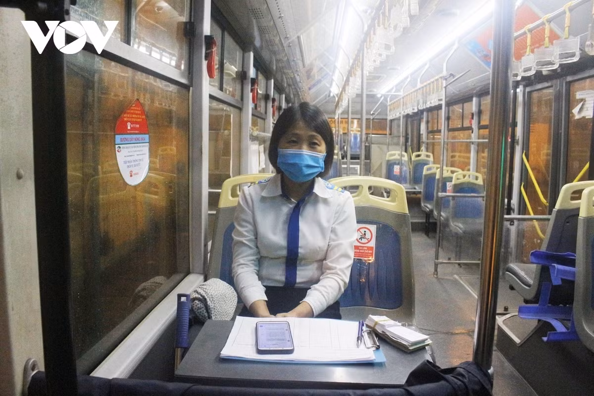 Besides the driver, the bus conductor is ready to go through the same routine every day.