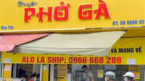 Locals apply pandemic counter measures at eateries in Hanoi