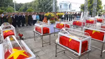 Remains of martyrs repatriated from Laos reburied in Dien Bien