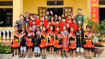 Police officers teach English to children in remote areas