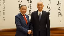 Minister To Lam co-chairs 8th Conference on Crime Prevention and Control in China