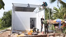 Local police step up progress of building houses for needy Khmer people in Soc Trang