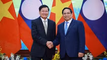 Prime Minister welcomes Lao Party General Secretary and President in Hanoi