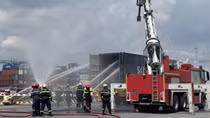 Police conduct firefighting and rescue drill in seaport