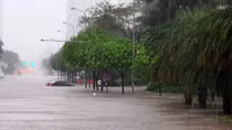 Hanoi streets turn into rivers after heavy downpours