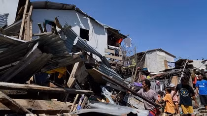 Typhoon Rai climbs as affected Filipinos ask for help