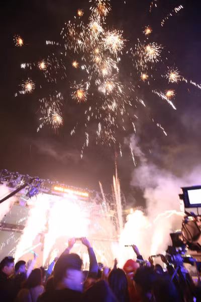 Hanoians enjoy a small fireworks show as the countdown to 2018 hits 0.